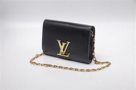 louis vuitton black bag with gold chain|louis vuitton book chain wallet.